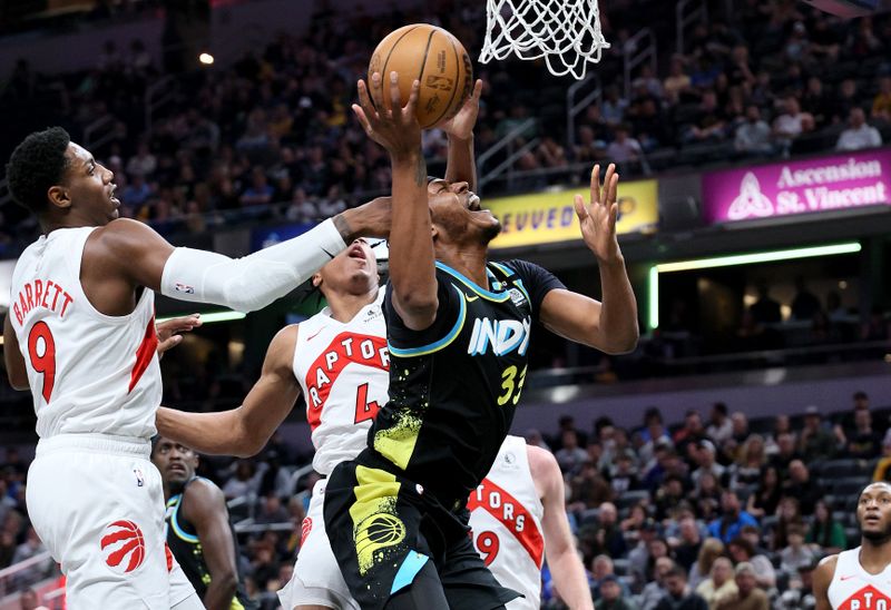 INDIANAPOLIS, INDIANA - FEBRUARY 26:   Myles Turner #33 of the Indiana Pacers shoots the ball while defended by RJ Barrett #9 of  the Toronto Raptors at Gainbridge Fieldhouse on February 26, 2024 in Indianapolis, Indiana.    NOTE TO USER: User expressly acknowledges and agrees that, by downloading and or using this photograph, User is consenting to the terms and conditions of the Getty Images License Agreement.  (Photo by Andy Lyons/Getty Images)