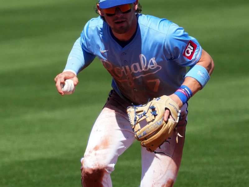 Mar 11, 2024; Surprise, Arizona, USA; Kansas City Royals shortstop Bobby Witt Jr. (7) fields a ball against the San Francisco Giants during the second inning at Surprise Stadium. Mandatory Credit: Joe Camporeale-USA TODAY Sports