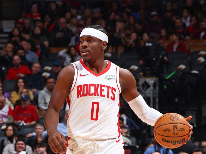 TORONTO, CANADA - FEBRUARY 9: Aaron Holiday #0 of the Houston Rockets brings the ball up court during the game against the Toronto Raptors on February 9, 2024 at the Scotiabank Arena in Toronto, Ontario, Canada.  NOTE TO USER: User expressly acknowledges and agrees that, by downloading and or using this Photograph, user is consenting to the terms and conditions of the Getty Images License Agreement.  Mandatory Copyright Notice: Copyright 2024 NBAE (Photo by Vaughn Ridley/NBAE via Getty Images)