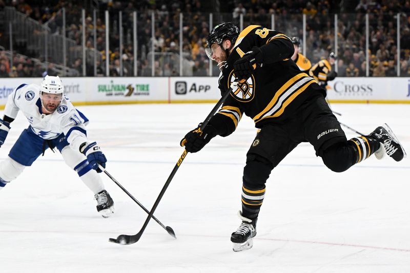 Jan 14, 2025; Boston, Massachusetts, USA; Tampa Bay Lightning center Luke Glendening (11) defends Boston Bruins right wing David Pastrnak (88) during the first period at the TD Garden. Mandatory Credit: Brian Fluharty-Imagn Images