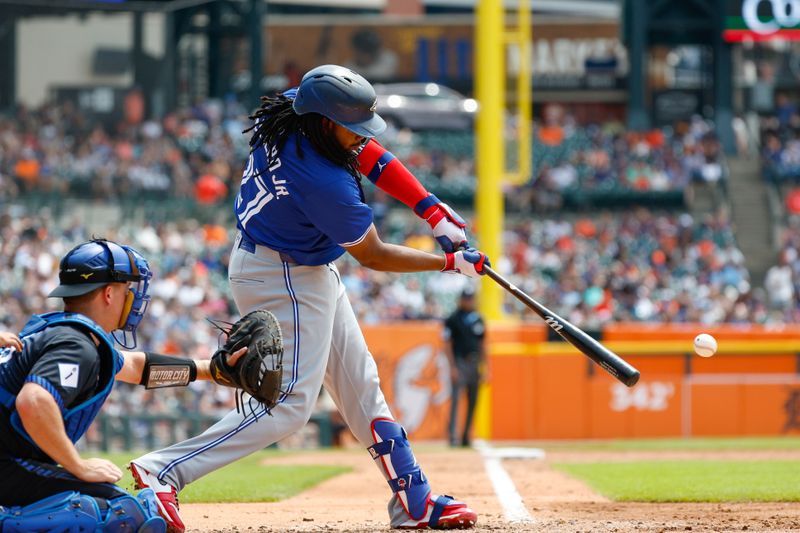 May 26, 2024; Detroit, Michigan, USA; Toronto Blue Jays first baseman Vladimir Guerrero Jr. (27) hits during an at bat in the third inning of the game against the Detroit Tigers at Comerica Park. Mandatory Credit: Brian Bradshaw Sevald-USA TODAY Sports