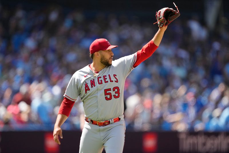 Jul 30, 2023; Toronto, Ontario, CAN; Los Angeles Angels pitcher Carlos Estevez (53) reacts after the final out against the Toronto Blue Jays during the tenth inning at Rogers Centre. Mandatory Credit: John E. Sokolowski-USA TODAY Sports