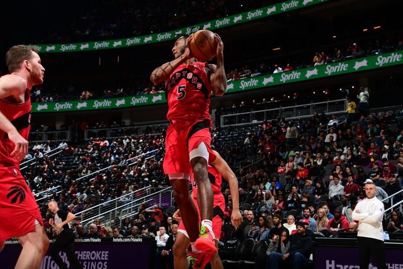 ATLANTA, GA - February 23: Immanuel Quickley #5 of the Toronto Raptors grabs a rebound during the game against the Atlanta Hawks on February 23, 2024 at State Farm Arena in Atlanta, Georgia.  NOTE TO USER: User expressly acknowledges and agrees that, by downloading and/or using this Photograph, user is consenting to the terms and conditions of the Getty Images License Agreement. Mandatory Copyright Notice: Copyright 2024 NBAE (Photo by Scott Cunningham/NBAE via Getty Images)