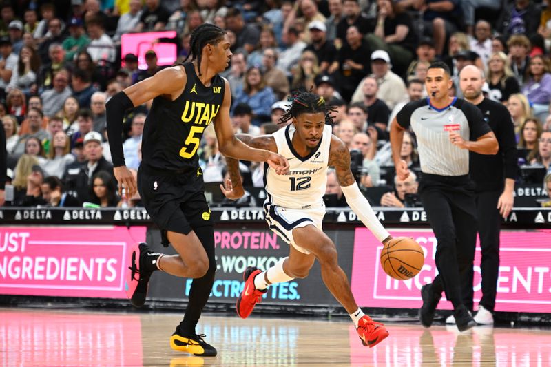 SALT LAKE CITY, UTAH - OCTOBER 23: Ja Morant #12 of the Memphis Grizzlies drives against Cody Williams #5 of the Utah Jazz during the third quarter at Delta Center on October 23, 2024 in Salt Lake City, Utah. NOTE TO USER: User expressly acknowledges and agrees that, by downloading and or using this photograph, User is consenting to the terms and conditions of the Getty Images License Agreement. (Photo by Alex Goodlett/Getty Images)