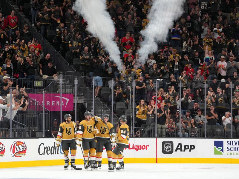 Oct 4, 2022; Las Vegas, Nevada, USA; Vegas Golden Knights defenseman Zack Hayes (65) celebrates with team mates after scoring a goal against the Arizona Coyotes during a preseason game at T-Mobile Arena. Mandatory Credit: Stephen R. Sylvanie-USA TODAY Sports