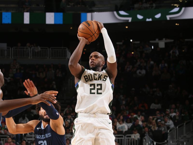 MILWAUKEE, WI - OCTOBER 20: Khris Middleton #22 of the Milwaukee Bucks shoots a three point basket during the preseason game on October 20, 2023 at the Fiserv Forum Center in Milwaukee, Wisconsin. NOTE TO USER: User expressly acknowledges and agrees that, by downloading and or using this Photograph, user is consenting to the terms and conditions of the Getty Images License Agreement. Mandatory Copyright Notice: Copyright 2023 NBAE (Photo by Gary Dineen/NBAE via Getty Images).