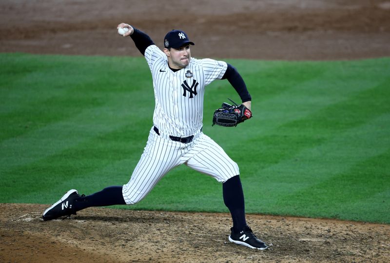 Oct 30, 2024; New York, New York, USA; New York Yankees pitcher Tommy Kahnle (41) throws during the eighth inning against the Los Angeles Dodgers in game five of the 2024 MLB World Series at Yankee Stadium. Mandatory Credit: Wendell Cruz-Imagn Images