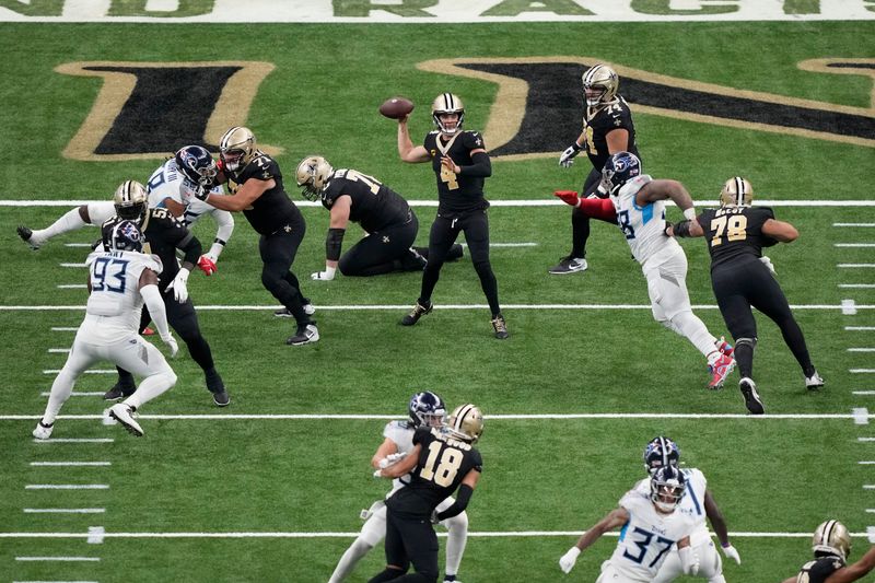 New Orleans Saints quarterback Derek Carr (4) passes in the second half of an NFL football game against the Tennessee Titans in New Orleans, Sunday, Sept. 10, 2023. (AP Photo/Gerald Herbert)