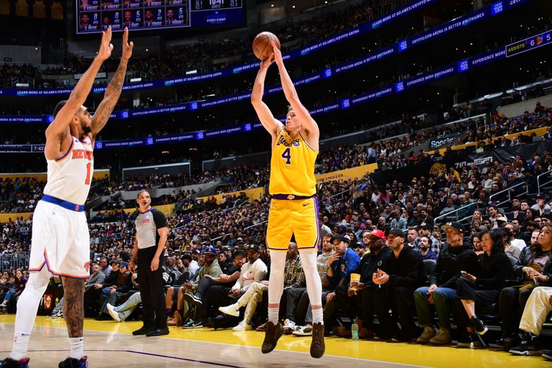 LOS ANGELES, CA - MARCH 6:  Dalton Knecht #4 of the Los Angeles Lakers shoots the ball during the game against the New York Knicks on March 6, 2025 at Crypto.Com Arena in Los Angeles, California. NOTE TO USER: User expressly acknowledges and agrees that, by downloading and/or using this Photograph, user is consenting to the terms and conditions of the Getty Images License Agreement. Mandatory Copyright Notice: Copyright 2025 NBAE (Photo by Adam Pantozzi/NBAE via Getty Images)