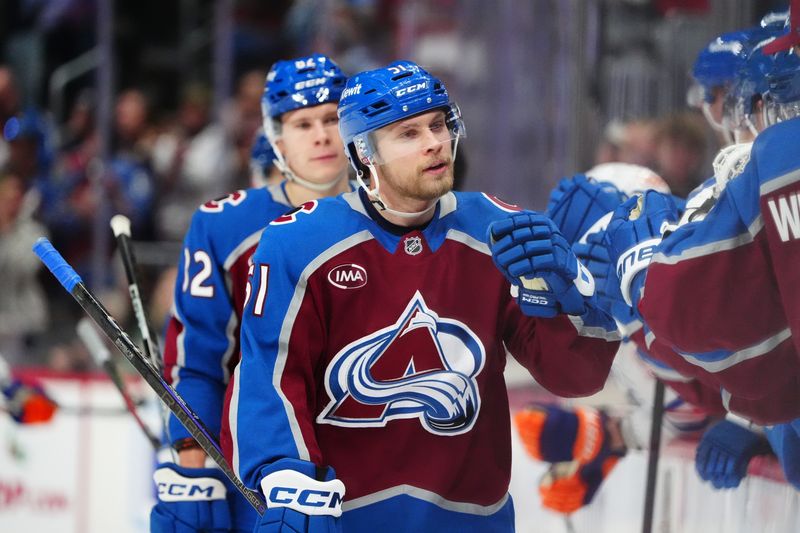 Nov 30, 2024; Denver, Colorado, USA; Colorado Avalanche right wing Nikolai Kovalenko (51) celebrates his goal in the first period against the Edmonton Oilers at Ball Arena. Mandatory Credit: Ron Chenoy-Imagn Images