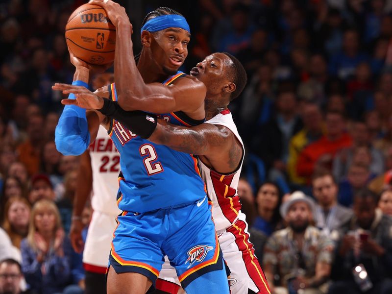 OKLAHOMA CITY, OK - MARCH 8:  Shai Gilgeous-Alexander #2 of the Oklahoma City Thunder handles the ball during the game as Terry Rozier #2 of the Miami Heat plays defense on March 8, 2024 at Paycom Arena in Oklahoma City, Oklahoma. NOTE TO USER: User expressly acknowledges and agrees that, by downloading and or using this photograph, User is consenting to the terms and conditions of the Getty Images License Agreement. Mandatory Copyright Notice: Copyright 2024 NBAE (Photo by Zach Beeker/NBAE via Getty Images)