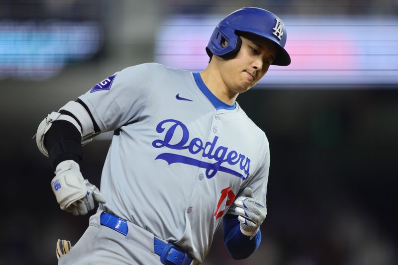 Sep 19, 2024; Miami, Florida, USA; Los Angeles Dodgers designated hitter Shohei Ohtani (17) circles the bases after hitting a two-run home run against the Miami Marlins during the seventh inning at loanDepot Park. Mandatory Credit: Sam Navarro-Imagn Images