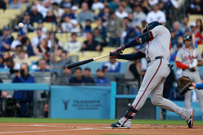 May 3, 2024; Los Angeles, California, USA;  Atlanta Braves third base Austin Riley (27) hits a home run in the first inning against the Los Angeles Dodgers at Dodger Stadium. Mandatory Credit: Kiyoshi Mio-USA TODAY Sports