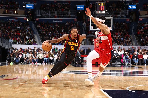 WASHINGTON, DC -? DECEMBER 31: Dejounte Murray #5 of the Atlanta Hawks drives to the basket during the game against the Washington Wizards on December 31, 2023 at Capital One Arena in Washington, DC. NOTE TO USER: User expressly acknowledges and agrees that, by downloading and or using this Photograph, user is consenting to the terms and conditions of the Getty Images License Agreement. Mandatory Copyright Notice: Copyright 2023 NBAE (Photo by Kenny Giarla/NBAE via Getty Images)