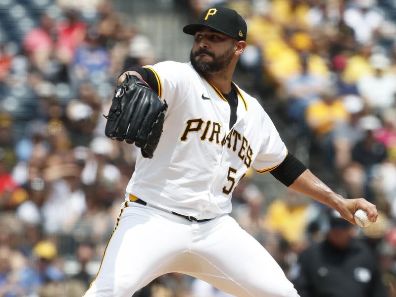 May 26, 2024; Pittsburgh, Pennsylvania, USA;  Pittsburgh Pirates starting pitcher Martín Pérez (54) delivers a pitch against the Atlanta Braves during the first inning at PNC Park. Mandatory Credit: Charles LeClaire-USA TODAY Sports