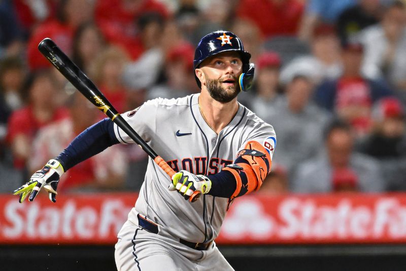 Sep 27, 2025; Anaheim, California, USA; Houston Astros first baseman Christian Walker (8) forced out at first base against the Los Angeles Angels during the sixth inning at Angel Stadium. Mandatory Credit: Jonathan Hui-Imagn Images