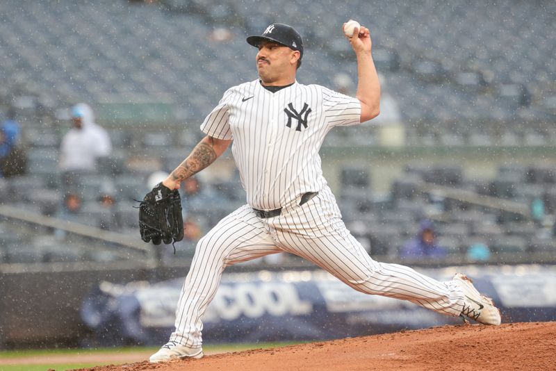 May 5, 2024; Bronx, New York, USA; New York Yankees starting pitcher Nestor Cortes (65) delivers a pitch seventh inning against the Detroit Tigers at Yankee Stadium. Mandatory Credit: Vincent Carchietta-USA TODAY Sports