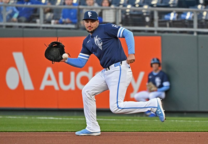 Apr 5, 2024; Kansas City, Missouri, USA; Kansas City Royals first baseman Vinnie Pasquantino (9) makes a play on the ball in the first inning against the Chicago White Sox  at Kauffman Stadium. Mandatory Credit: Peter Aiken-USA TODAY Sports