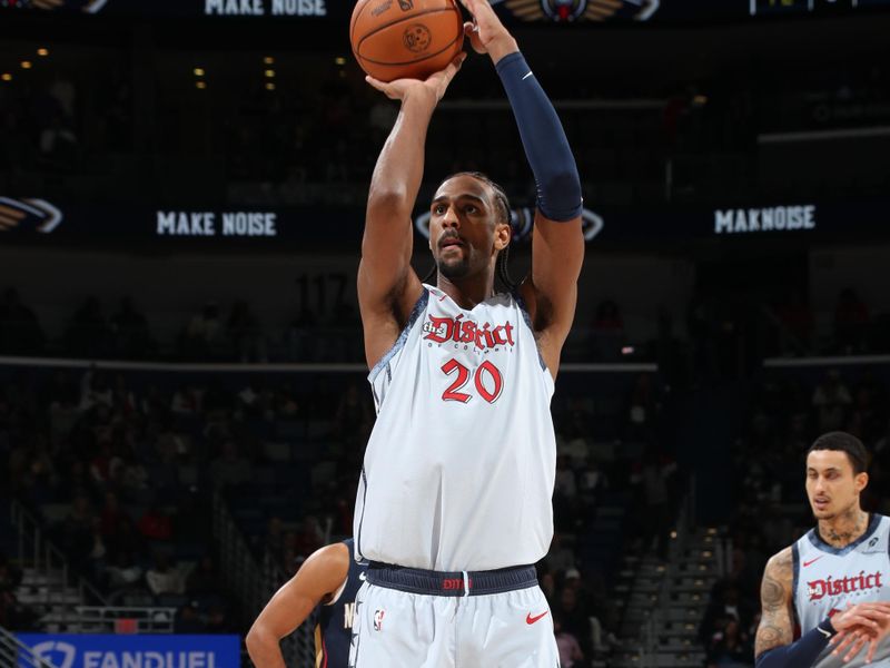 NEW ORLEANS, LA - JANUARY 3:  Alexandre Sarr #20 of the Washington Wizards shoots a free throw during the game against the New Orleans Pelicans on January 3, 2025 at the Smoothie King Center in New Orleans, Louisiana. NOTE TO USER: User expressly acknowledges and agrees that, by downloading and or using this Photograph, user is consenting to the terms and conditions of the Getty Images License Agreement. Mandatory Copyright Notice: Copyright 2025 NBAE (Photo by Layne Murdoch Jr./NBAE via Getty Images)