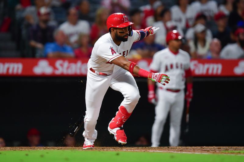 Sep 26, 2023; Anaheim, California, USA; Los Angeles Angels center fielder Jo Adell (7) runs after hitting a single against the Texas Rangers during the fourth inning at Angel Stadium. Mandatory Credit: Gary A. Vasquez-USA TODAY Sports