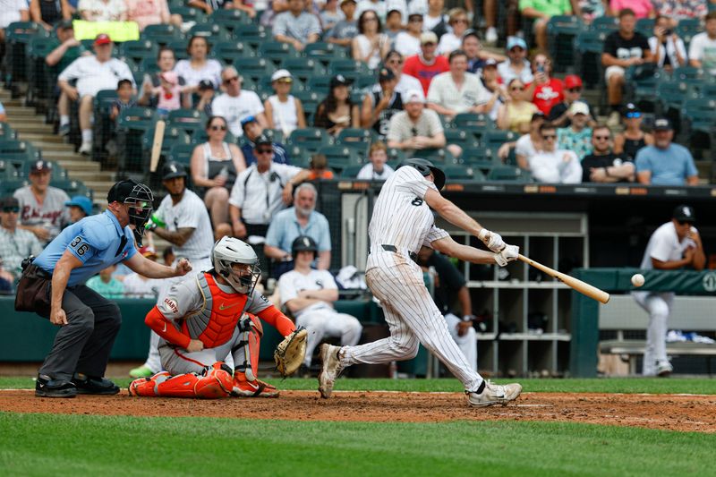 Jun 29, 2025; Chicago, Illinois, USA; Chicago White Sox catcher Kyle Teel (8) hits a two-run double against the San Francisco Giants during the seventh inning at Rate Field. Mandatory Credit: Kamil Krzaczynski-Imagn Images
