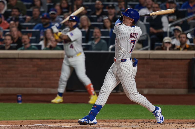 Sep 16, 2025; New York City, New York, USA; New York Mets third baseman Brett Baty (7) hits a two run home run during the first inning against the San Diego Padres at Citi Field. Mandatory Credit: Vincent Carchietta-Imagn Images