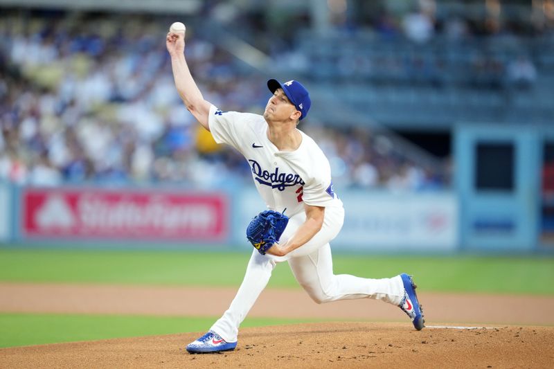 Aug 20, 2024; Los Angeles, California, USA; Los Angeles Dodgers starting pitcher Walker Buehler (21) throws in the first inning against the Seattle Mariners at Dodger Stadium. Mandatory Credit: Kirby Lee-USA TODAY Sports