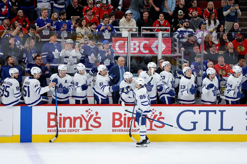 Nov 15, 2025; Chicago, Illinois, USA; Toronto Maple Leafs left wing Nicholas Robertson (89) celebrates with teammates after scoring against the Chicago Blackhawks during the first period at United Center. Mandatory Credit: Kamil Krzaczynski-Imagn Images