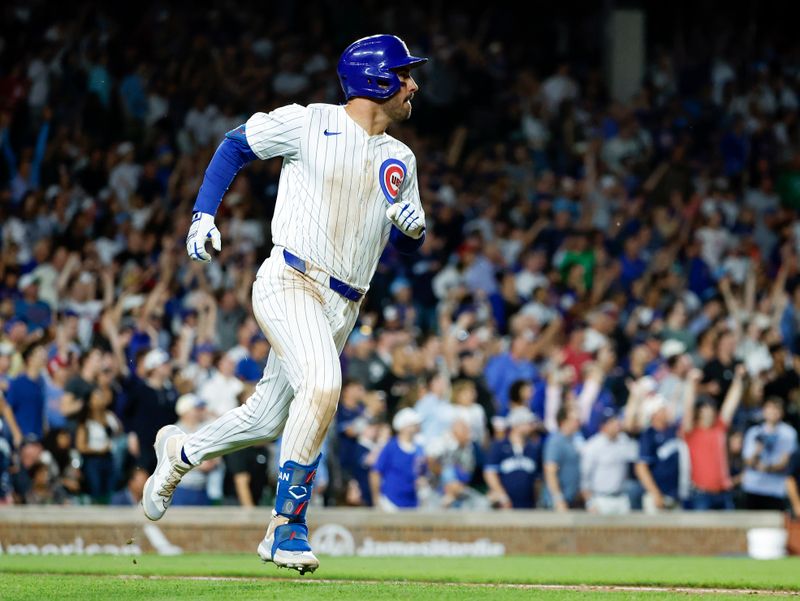 Jun 5, 2024; Chicago, Illinois, USA; Chicago Cubs outfielder Mike Tauchman (40) rounds the bases after hitting a walk-off home run against the Chicago White Sox during the ninth inning at Wrigley Field. Mandatory Credit: Kamil Krzaczynski-USA TODAY Sports
