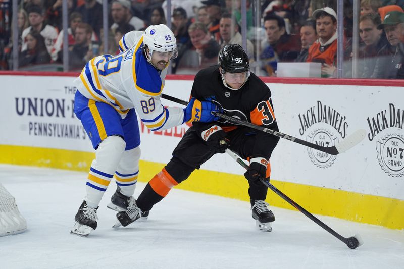 Nov 16, 2024; Philadelphia, Pennsylvania, USA; Philadelphia Flyers defenseman Emil Andrae (36) pushes the puck away from Buffalo Sabres right wing Alex Tuch (89) in the second period at Wells Fargo Center. Mandatory Credit: Kyle Ross-Imagn Images