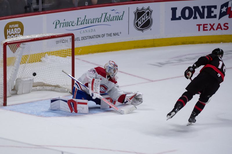 Apr 13, 2024; Ottawa, Ontario, CAN; Ottawa Senators right wing Drake Batherson (19) scores the winning goal in a shootout at the Canadian Tire Centre against Montreal Canadiens goalie Cayden Primeau (30). Mandatory Credit: Marc DesRosiers-USA TODAY Sports