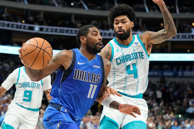 DALLAS, TEXAS - NOVEMBER 05: Kyrie Irving #11 of the Dallas Mavericks drives to the basket as Nick Richards #4 of the Charlotte Hornets defends during the first half at American Airlines Center on November 05, 2023 in Dallas, Texas. NOTE TO USER: User expressly acknowledges and agrees that, by downloading and or using this photograph, User is consenting to the terms and conditions of the Getty Images License Agreement. (Photo by Sam Hodde/Getty Images)