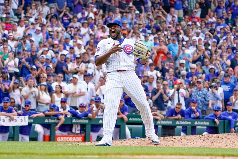 Jun 22, 2024; Chicago, Illinois, USA; Chicago Cubs pitcher Héctor Neris (51) reacts after getting the last out against the New York Mets during the ninth inning at Wrigley Field. Mandatory Credit: David Banks-USA TODAY Sports