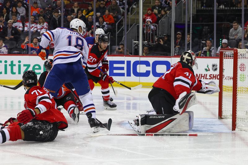 Dec 21, 2023; Newark, New Jersey, USA; Edmonton Oilers center Connor McDavid (97) (not shown) scores a goal on New Jersey Devils goaltender Vitek Vanecek (41) during the third period at Prudential Center. Mandatory Credit: Ed Mulholland-USA TODAY Sports