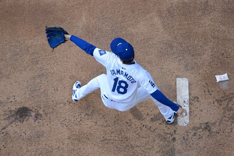 Oct 5, 2024; Los Angeles, California, USA; Los Angeles pitcher Yoshinobu Yamamoto (18) warms up before playing against the San Diego Padres in game one of the NLDS for the 2024 MLB Playoffs at Dodger Stadium. Mandatory Credit: Jayne Kamin-Oncea-Imagn Images