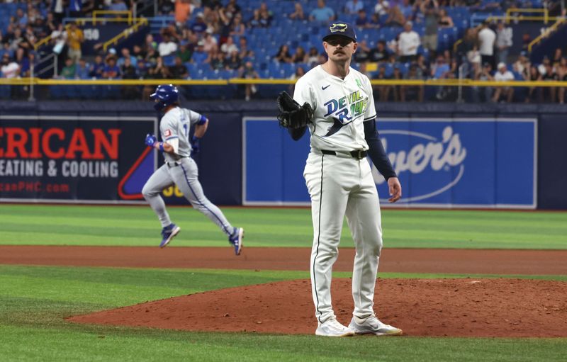 May 24, 2024; St. Petersburg, Florida, USA;  Tampa Bay Rays pitcher Tyler Alexander (14) looks on after he gave up a home run as Kansas City Royals shortstop Bobby Witt Jr. (7) runs the bases during the sixth inning at Tropicana Field. Mandatory Credit: Kim Klement Neitzel-USA TODAY Sports