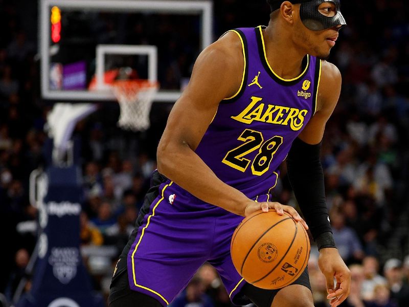 MINNEAPOLIS, MINNESOTA - DECEMBER 30: Rui Hachimura #28 of the Los Angeles Lakers dribbles the ball against the Minnesota Timberwolves in the third quarter at Target Center on December 30, 2023 in Minneapolis, Minnesota. The Timberwolves defeated the Lakers 108-106. NOTE TO USER: User expressly acknowledges and agrees that, by downloading and or using this photograph, User is consenting to the terms and conditions of the Getty Images License Agreement. (Photo by David Berding/Getty Images)