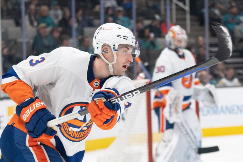 Mar 7, 2024; San Jose, California, USA; New York Islanders defenseman Adam Pelech (3) passes the puck during the second period against the San Jose Sharks at SAP Center at San Jose. Mandatory Credit: Stan Szeto-USA TODAY Sports