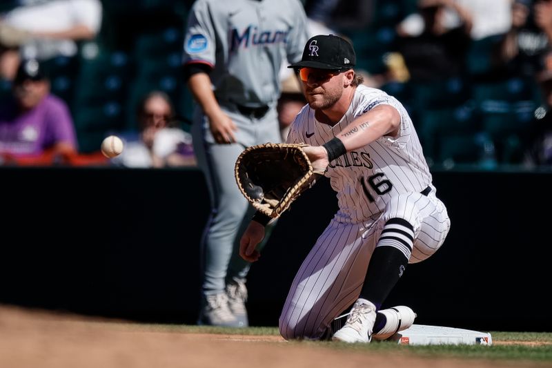 Sep 18, 2025; Denver, Colorado, USA; Colorado Rockies first baseman Blaine Crim (16) fields a throw at first in the seventh inning against the Miami Marlins at Coors Field. Mandatory Credit: Isaiah J. Downing-Imagn Images