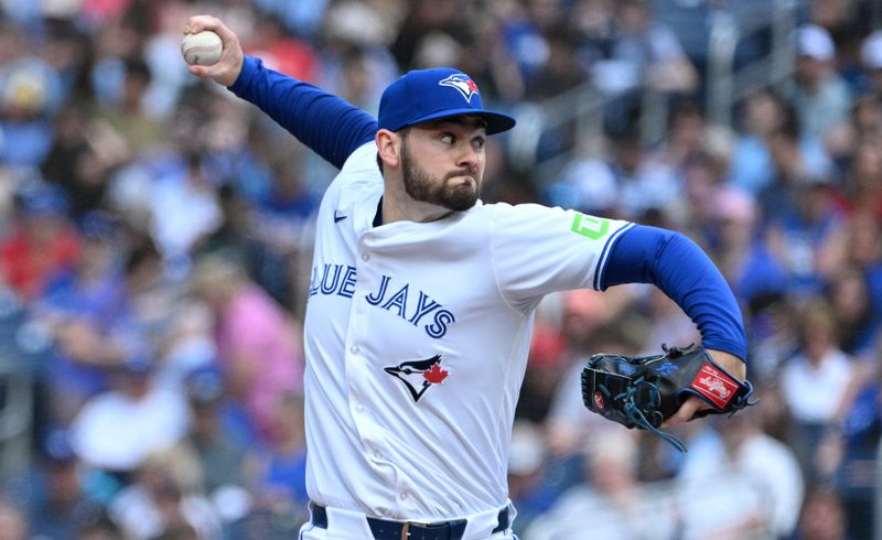 Jun 6, 2024; Toronto, Ontario, CAN;   Toronto Blue Jays relief pitcher Zach Pop (56) delivers a pitch against the Baltimore Orioles in the eighth inning at Rogers Centre. Mandatory Credit: Dan Hamilton-USA TODAY Sports