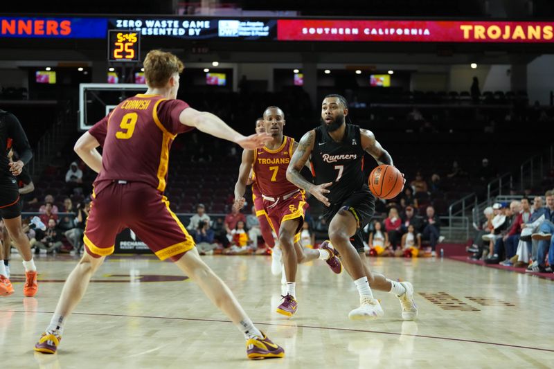 Dec 17, 2025; Los Angeles, California, USA; UTSA Roadrunners guard Jamir Simpson (7) dribbles the ball against Southern California Trojans guard Jordan Marsh (7) and guard Ryan Cornish (9) in the second half at Galen Center. Mandatory Credit: Kirby Lee-Imagn Images