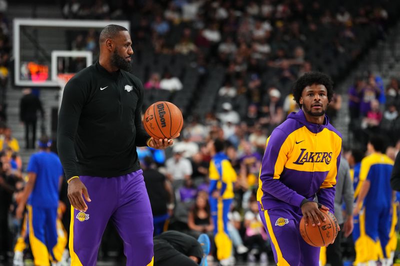 LAS VEGAS, NV - OCTOBER 15: LeBron James #23 and Bronny James #9 of the Los Angeles Lakers warms up before the game before the game against the Golden State Warriors during the 2024 NBA Preseason on October 15, 2024 at T-Mobile Arena in Las Vegas, Nevada. NOTE TO USER: User expressly acknowledges and agrees that, by downloading and or using this photograph, User is consenting to the terms and conditions of the Getty Images License Agreement. Mandatory Copyright Notice: Copyright 2024 NBAE  (Photo by Jeff Bottari/NBAE via Getty Images)