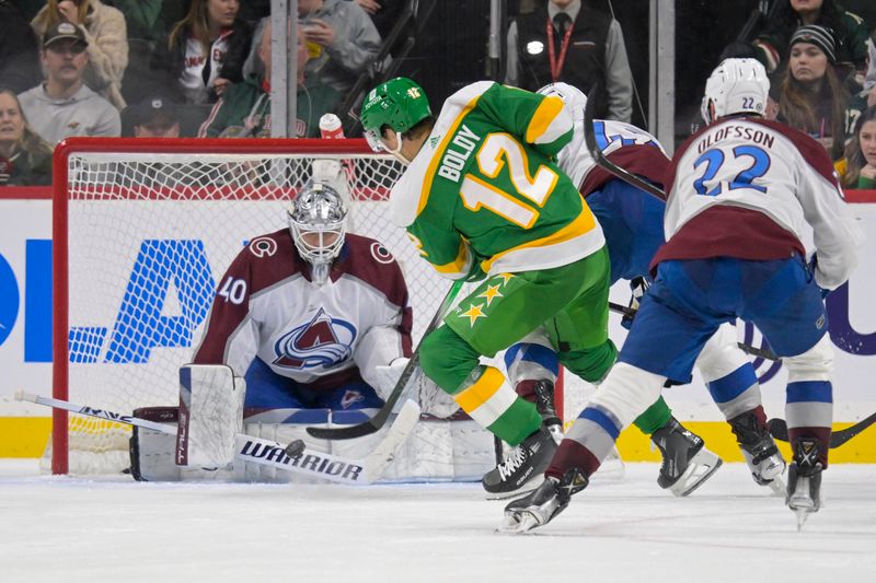 Nov 24, 2023; Saint Paul, Minnesota, USA; Colorado Avalanche goalie Alexandar Georgiev (40) makes a save on Minnesota Wild forward Matt Boldy (12) during the third period at Xcel Energy Center. Mandatory Credit: Nick Wosika-USA TODAY Sports