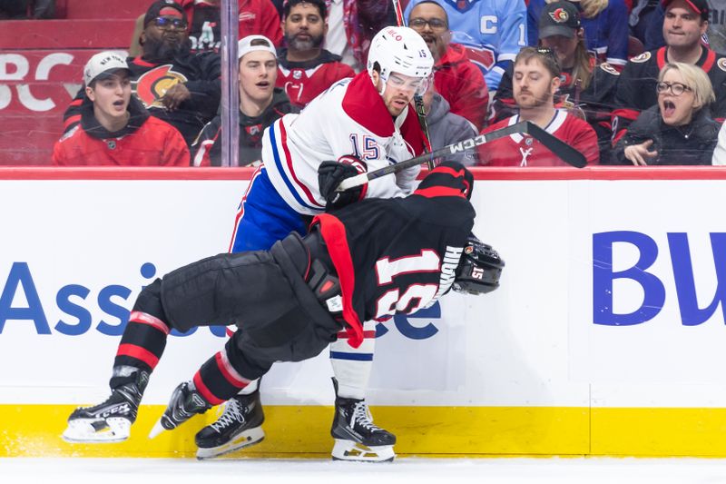 Apr 11, 2025; Ottawa, Ontario, CAN; Montreal Canadiens center Alex Newhook (15) takes down Ottawa Senators center Matthew Highmore (15) in the second period at the Canadian Tire Centre. Mandatory Credit: Marc DesRosiers-Imagn Images