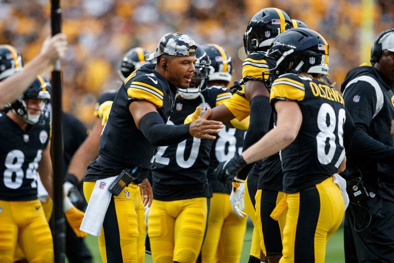 Pittsburgh Steelers quarterback Chris Oladokun (5) congratulates teammates during a preseason NFL football game, Saturday, Aug. 13, 2022, in Pittsburgh, PA. (AP Photo/Matt Durisko)