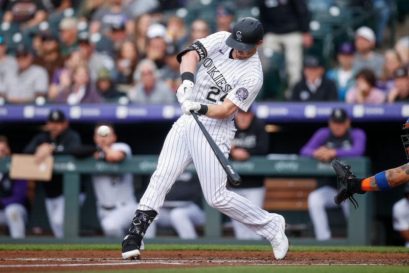 May 26, 2023; Denver, Colorado, USA; Colorado Rockies third baseman Ryan McMahon (24) hits a solo home run in the second inning against the New York Mets at Coors Field. Mandatory Credit: Isaiah J. Downing-USA TODAY Sports