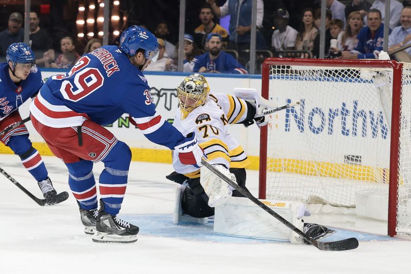 Sep 23, 2025; New York, New York, USA; New York Rangers center Sam Carrick (39) scores a goal past Boston Bruins goaltender Joonas Korpisalo (70) during the second period of a preseason game at Madison Square Garden. Mandatory Credit: Vincent Carchietta-Imagn Images