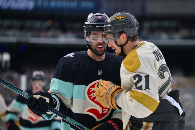 Jan 1, 2024; Seattle, Washington, USA; Seattle Kraken defenseman Justin Schultz (4) and Vegas Golden Knights center Brett Howden (21) during the first period in the 2024 Winter Classic ice hockey game at T-Mobile Park. Mandatory Credit: Steven Bisig-USA TODAY Sports