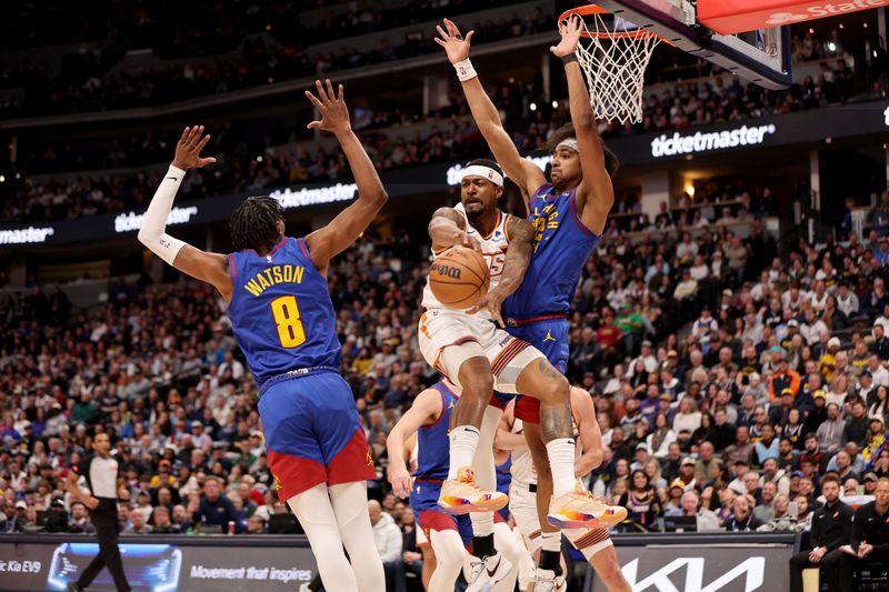 DENVER, COLORADO - MARCH 5: Bradley Beal #3 of the Phoenix Suns makes a pass against Zeke Nnaji #22 of the Denver Nuggets at Ball Arena on March 5, 2024 in Denver, Colorado. NOTE TO USER: User expressly acknowledges and agrees that, by downloading and/or using this Photograph, user is consenting to the terms and conditions of the Getty Images License Agreement. (Photo by Jamie Schwaberow/Getty Images)