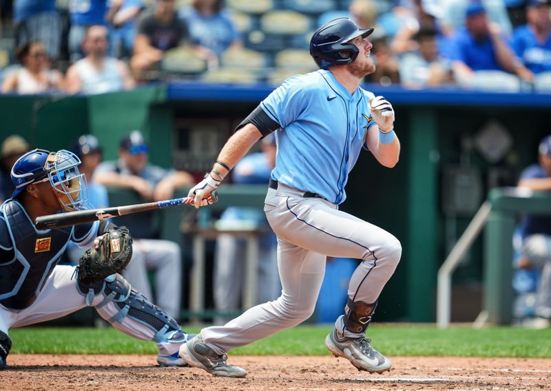 Jul 15, 2023; Kansas City, Missouri, USA; Tampa Bay Rays first baseman Luke Raley (55) hits a single against the Kansas City Royals during the sixth inning at Kauffman Stadium. Mandatory Credit: Jay Biggerstaff-USA TODAY Sports